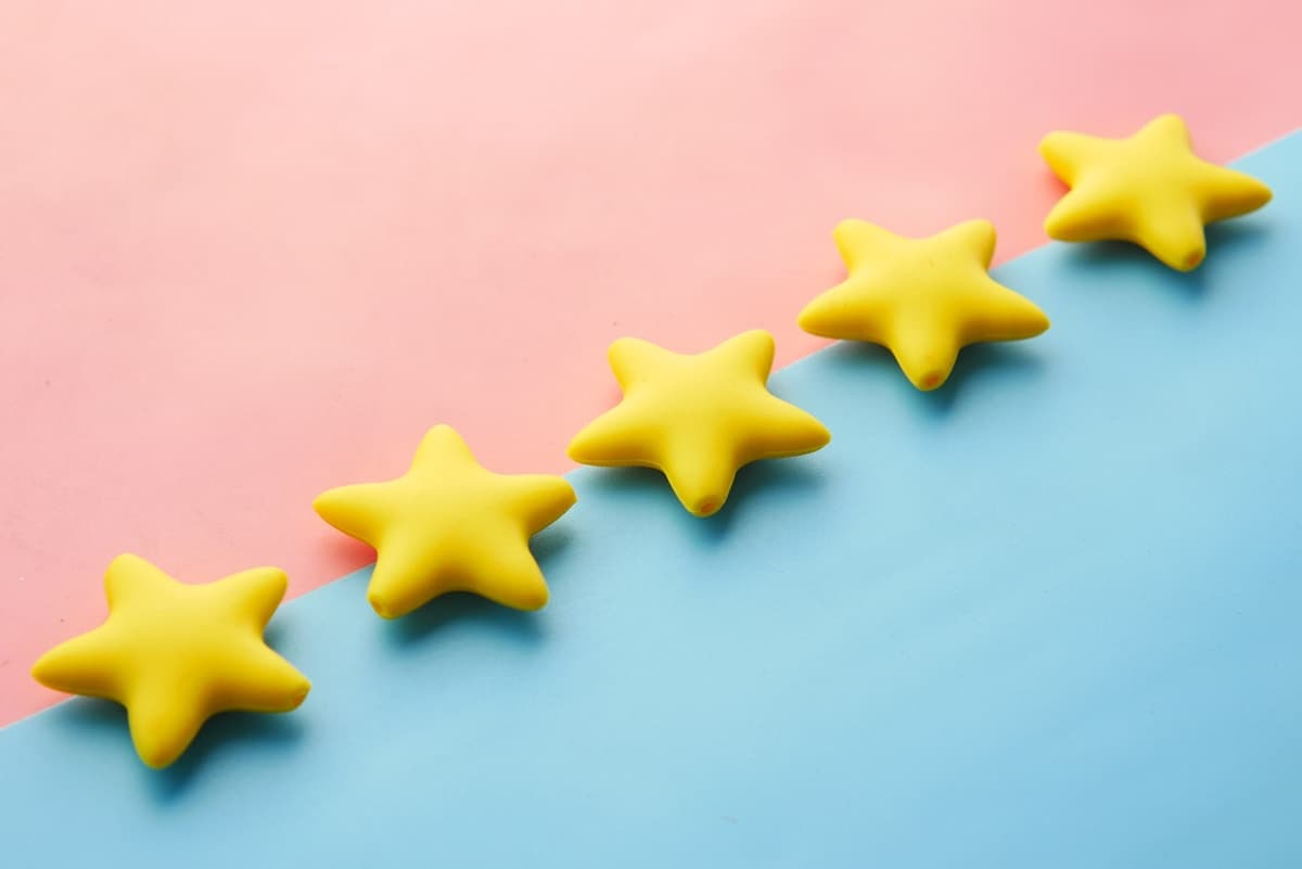 Five yellow stars representing five-star customer reviews on a smartphone screen